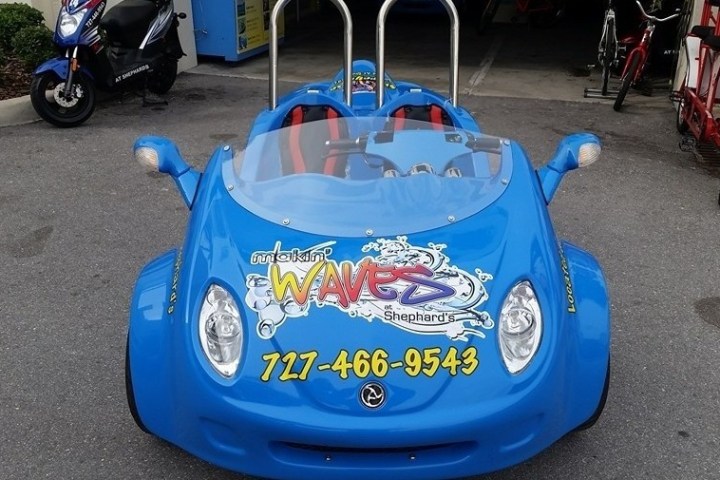 a table topped with a blue toy car